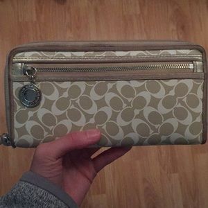 Gold and white coach wallet